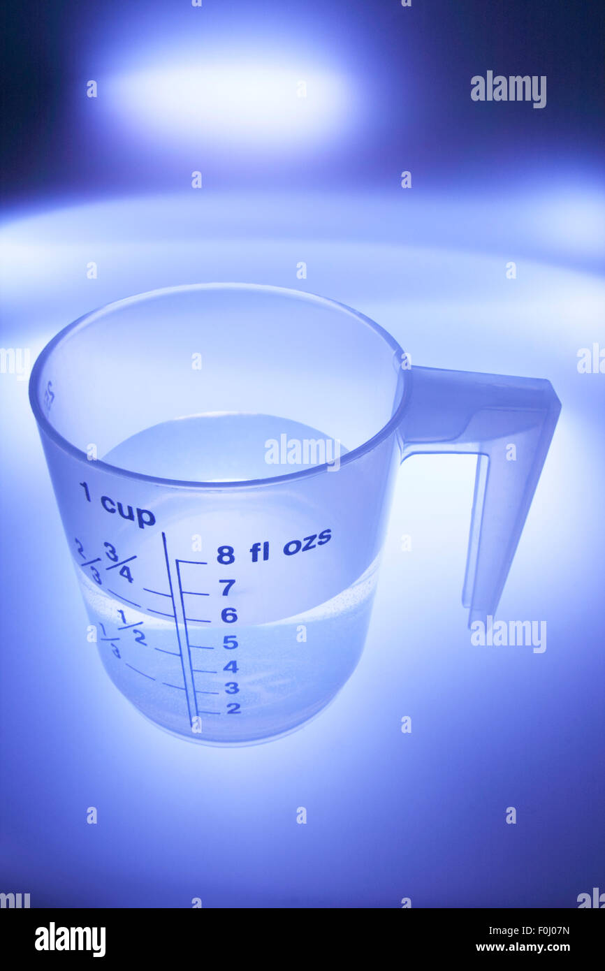 Water in Plastic Measuring Cup Stock Photo