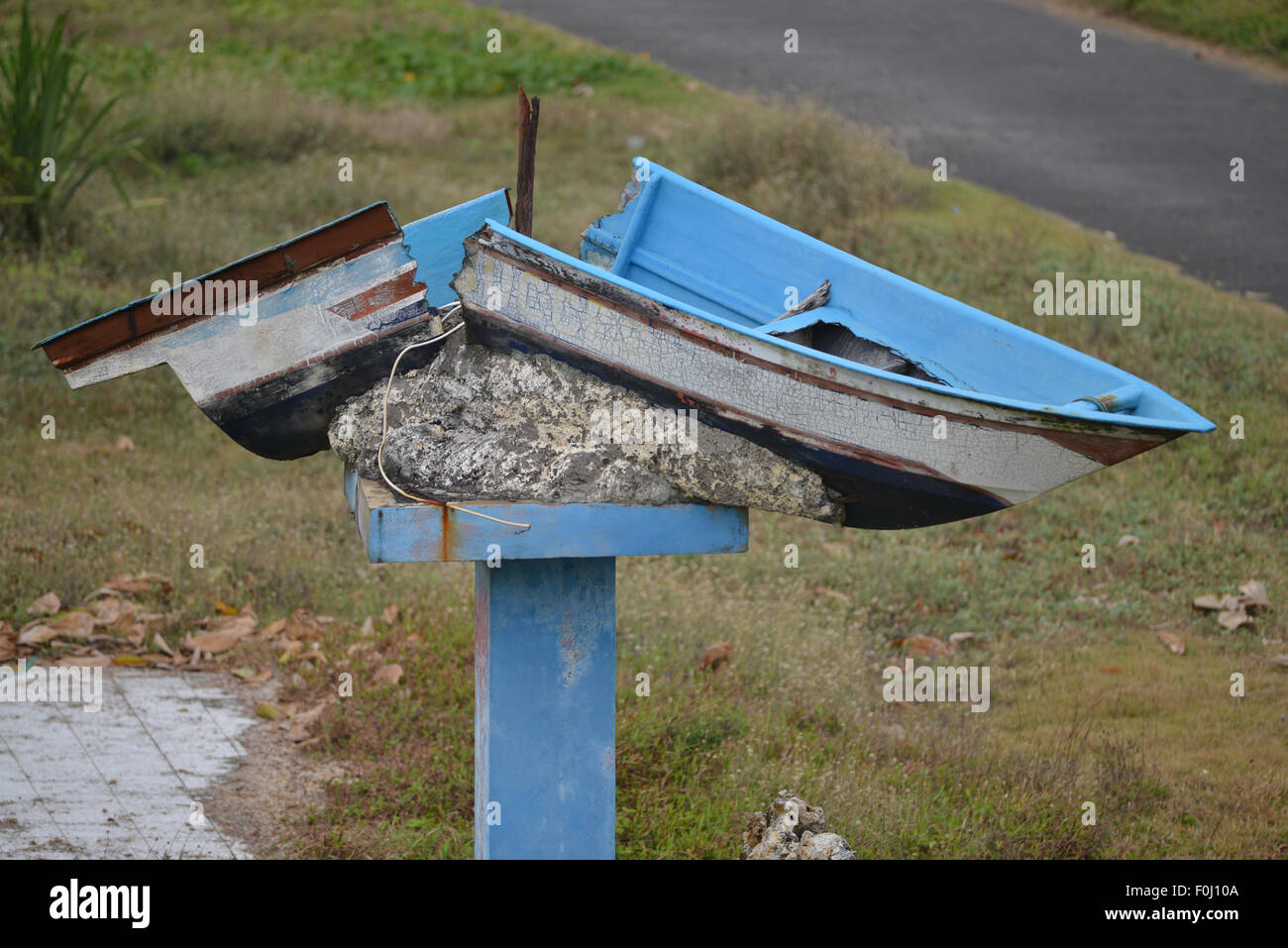 A tsunami damaged boat from 2006, along the coast in Pangandaran, West Java, Indonesia on August 10, 2015. Stock Photo