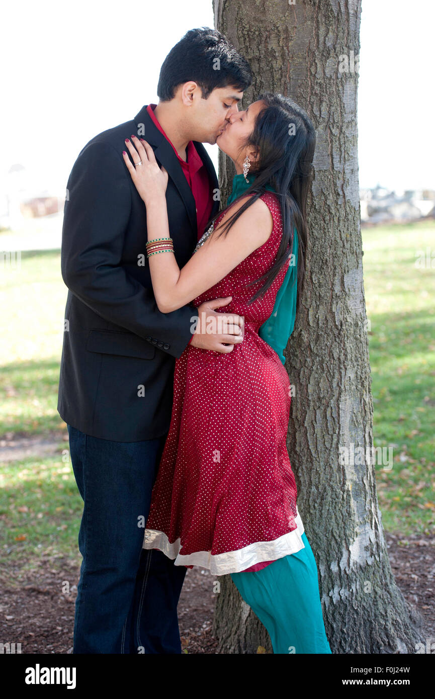 Indian young couple kissing hi-res stock photography and images