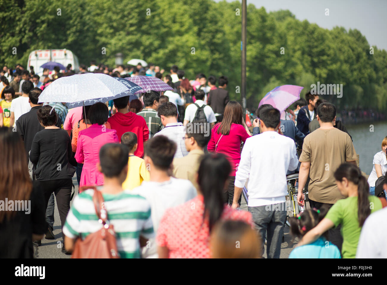 Crowd walking along the lake in Hangzhou on the 1st of May, the Labour Day in China, 2013. Stock Photo