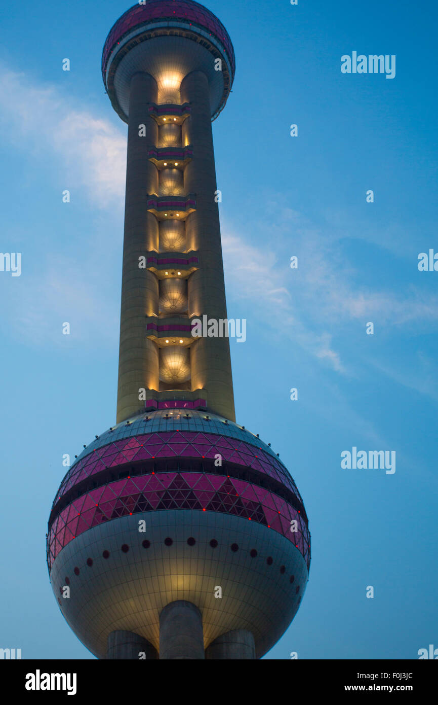 Close-up of the Pearl Tower in Shanghai with a blue sky behind Stock Photo