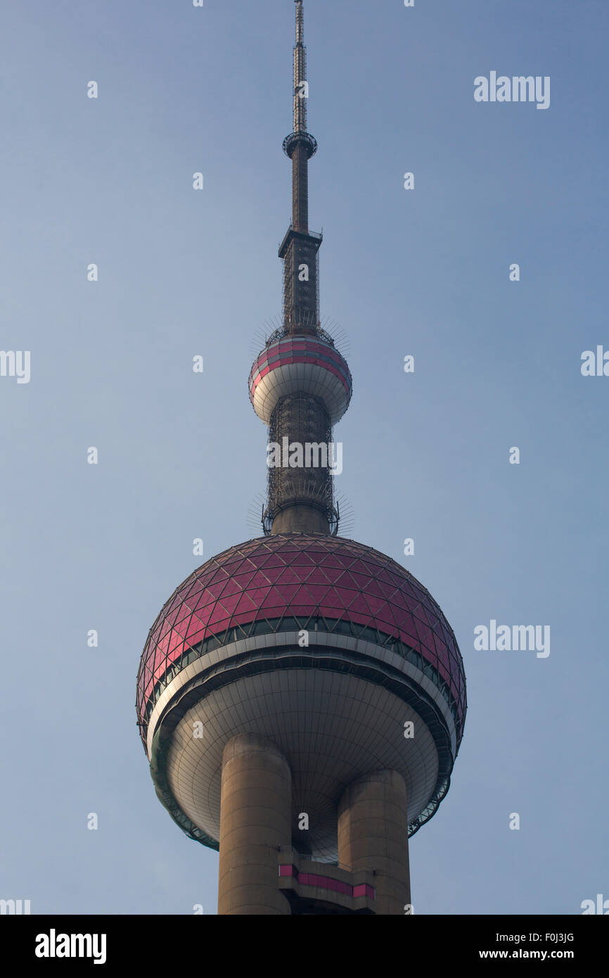 Close-up of the Pearl Tower in Shanghai with a blue sky behind Stock Photo