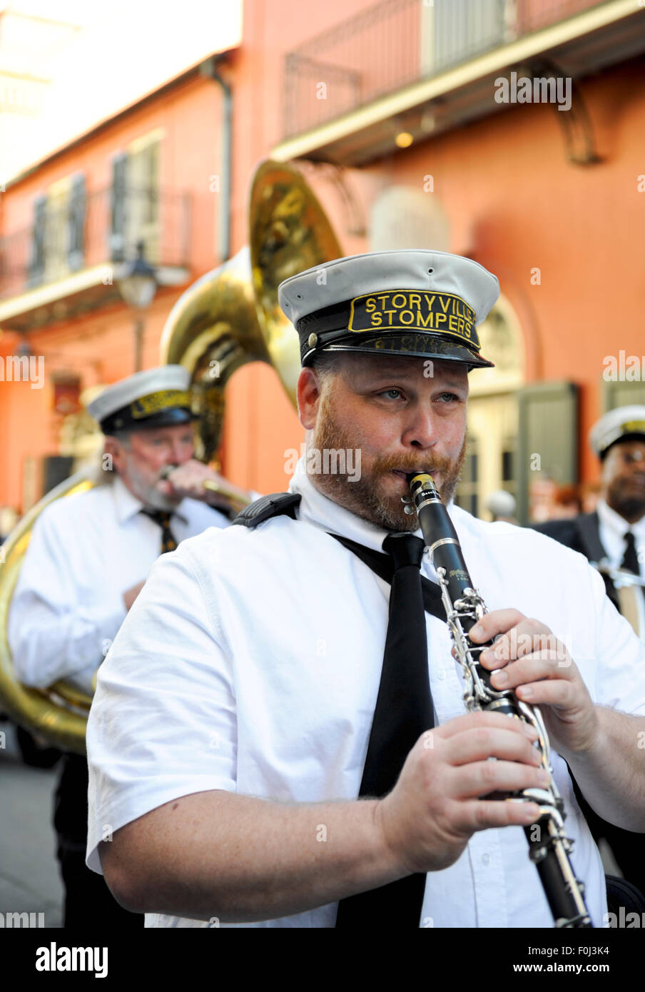 New Orleans street jazz musicians with clarinet player serenading down the streets of the French Quarter Stock Photo