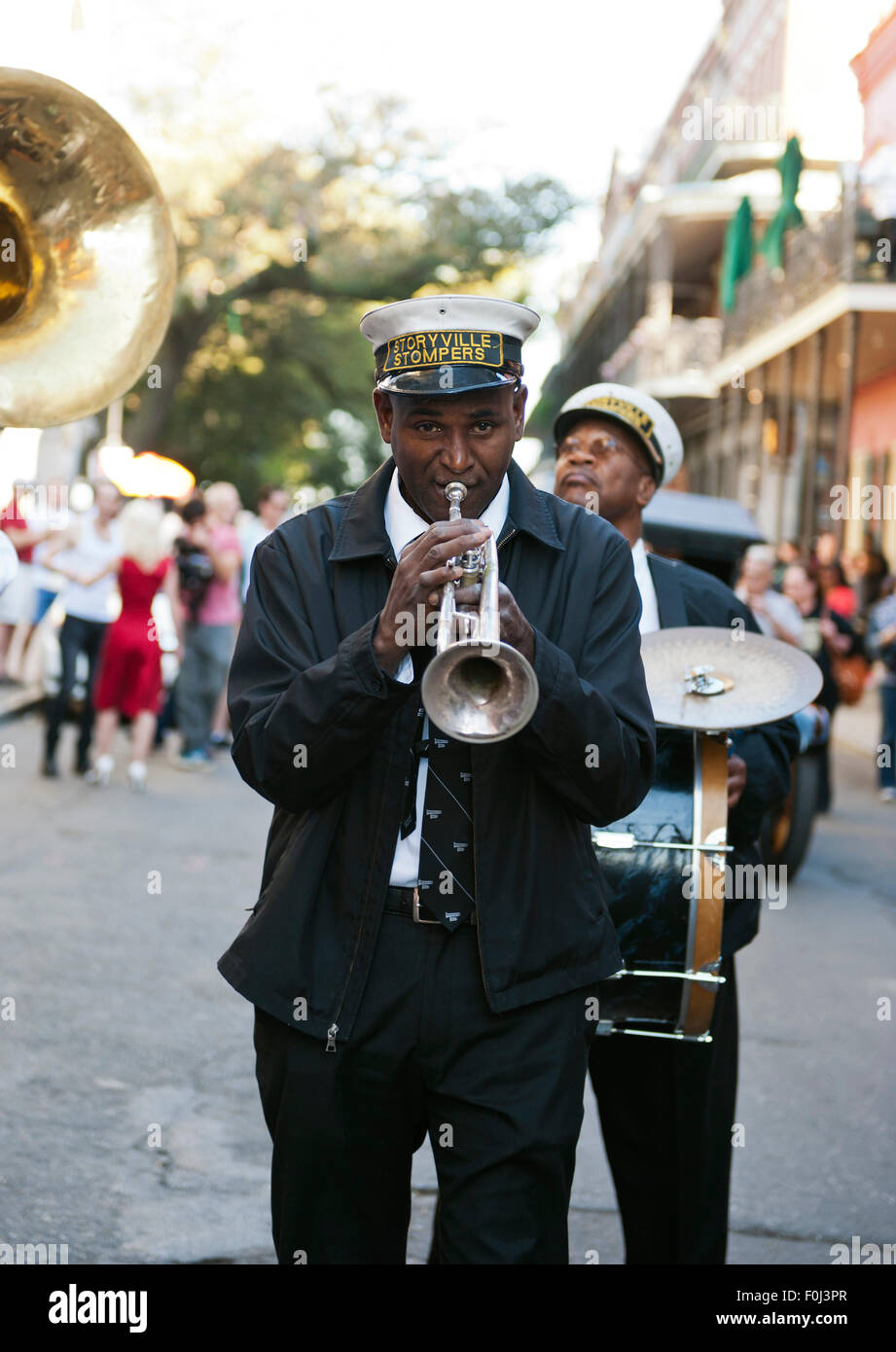 New Orleans street jazz musicians with trumpet player serenading down the streets of the French Quarter Stock Photo