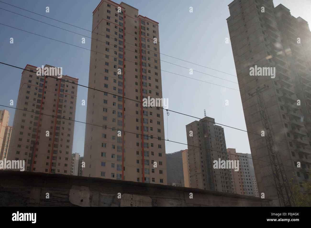 Urban development and high residential buildings along the train line in the North East of China, 2013. Stock Photo