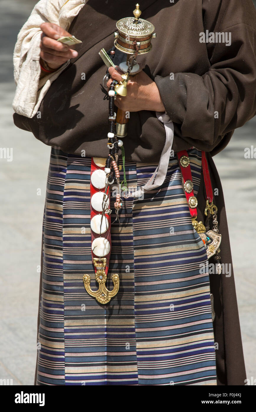Tibetan fabrics and accessories on a Tibetan woman, around the Potala Palace in Lhasa during the day, Tibet 2013. Stock Photo