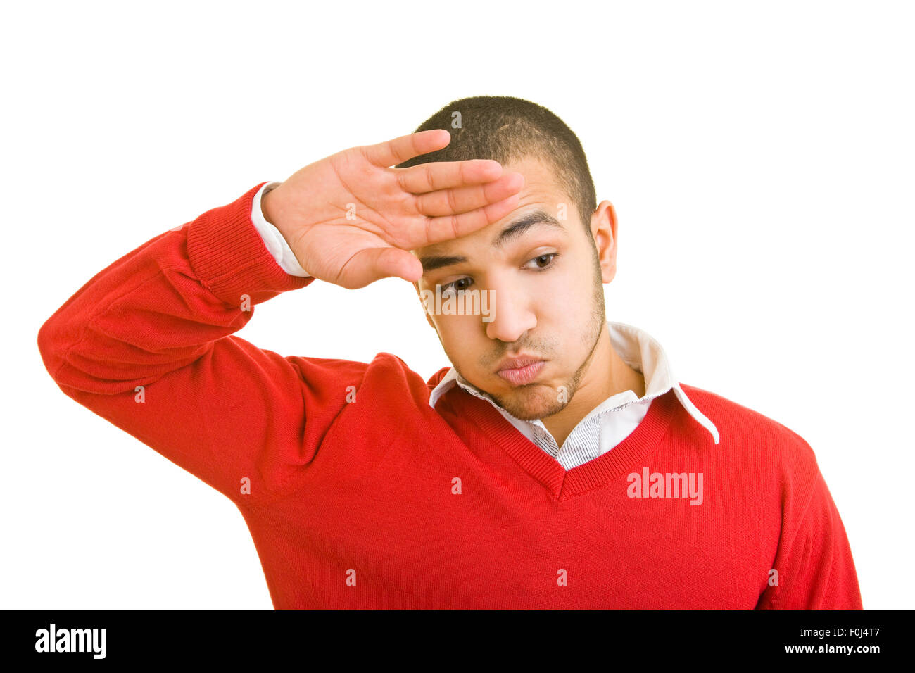 Exhausted man wiping sweat off his forehead Stock Photo