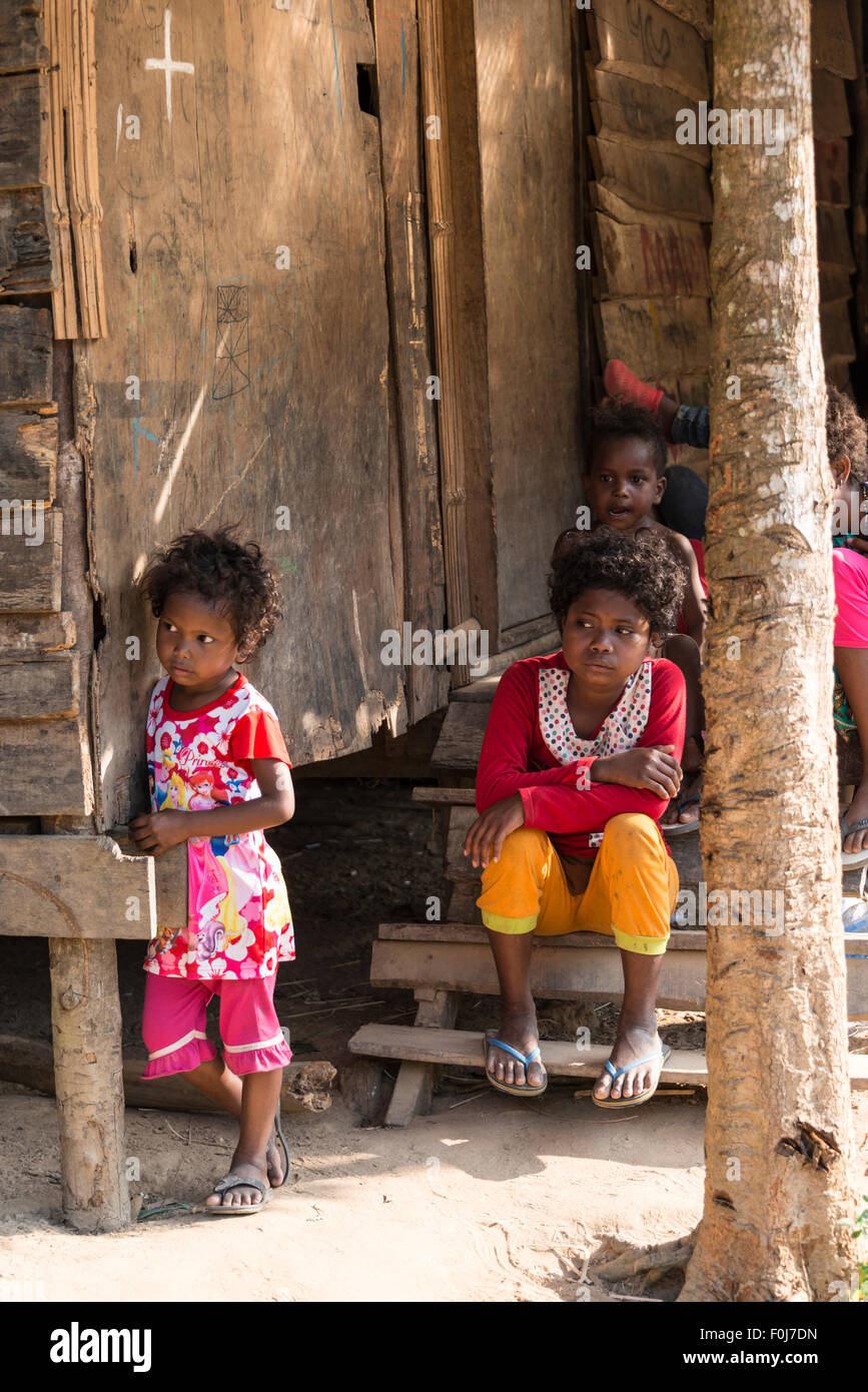 Two young girls in front of a house, Orang Asil tribe, aboriginal, indigenous people, Taman Negara National Park, Malaysia Stock Photo