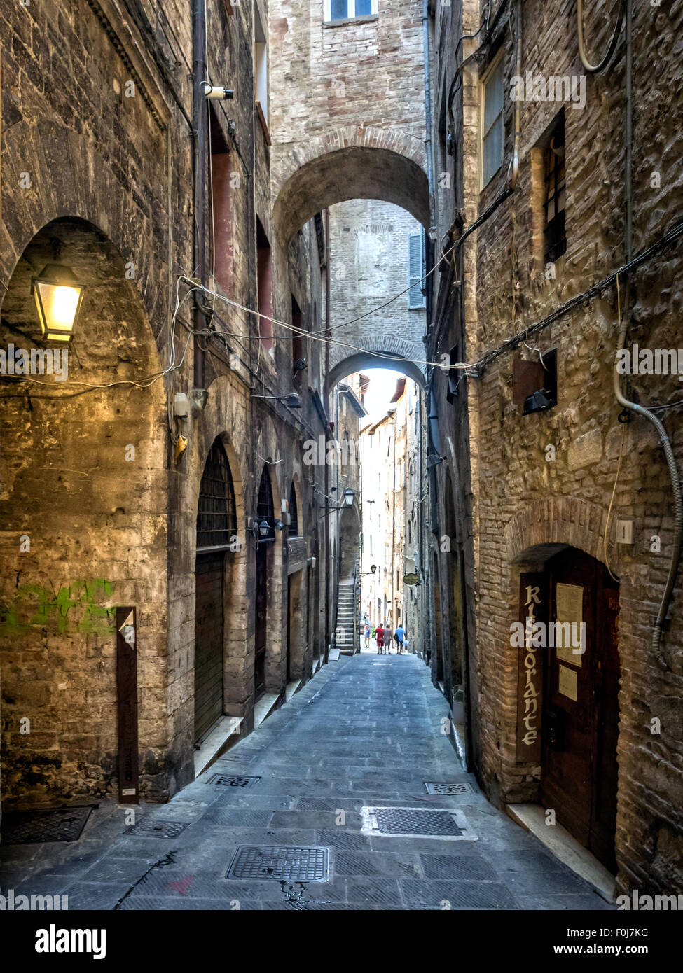 Narrow street with arches in Perugia, Umbria Italy Stock Photo - Alamy