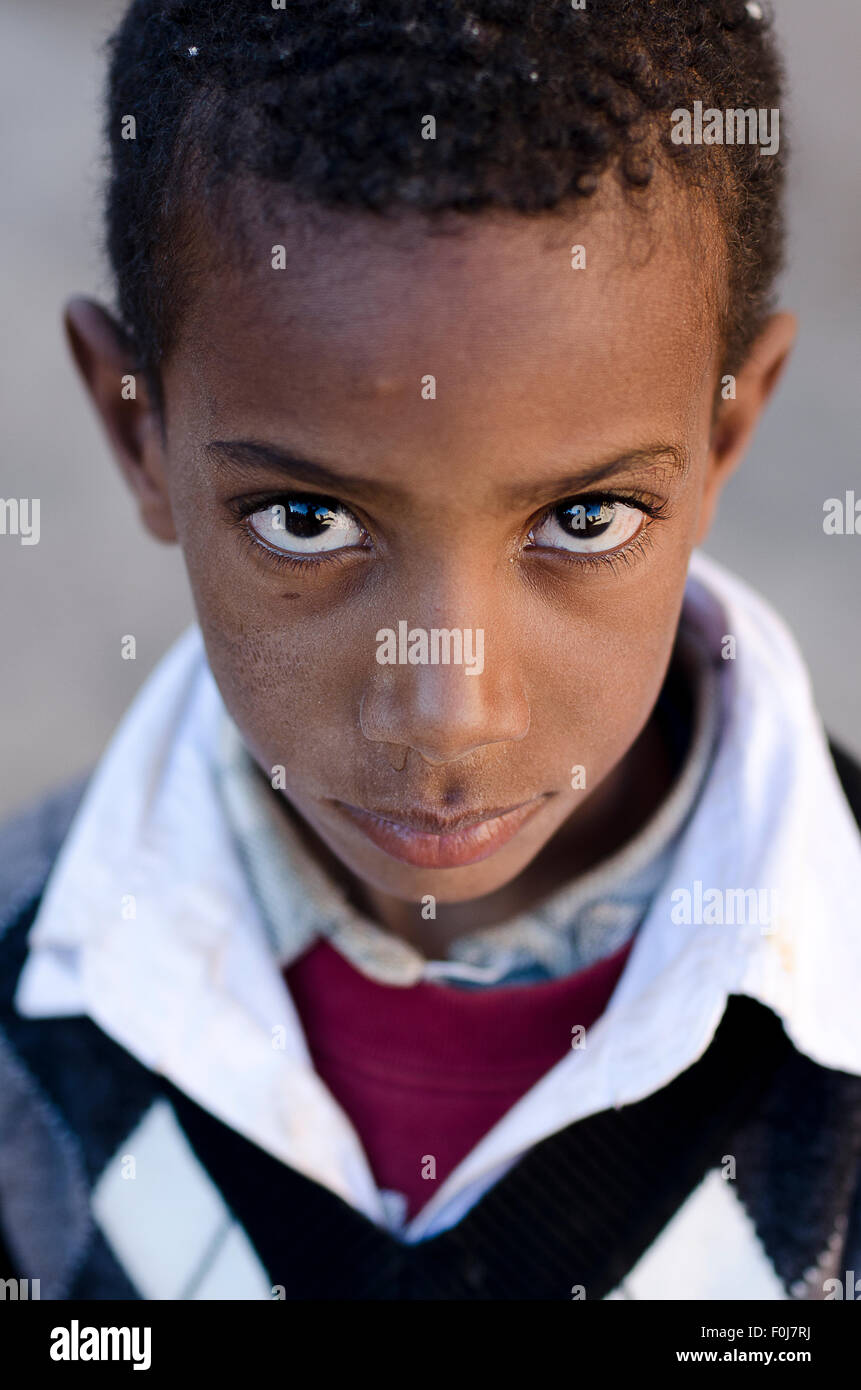 Boy looking up with big eyes, portrait, Asslim in Agdz, Morocco Stock Photo