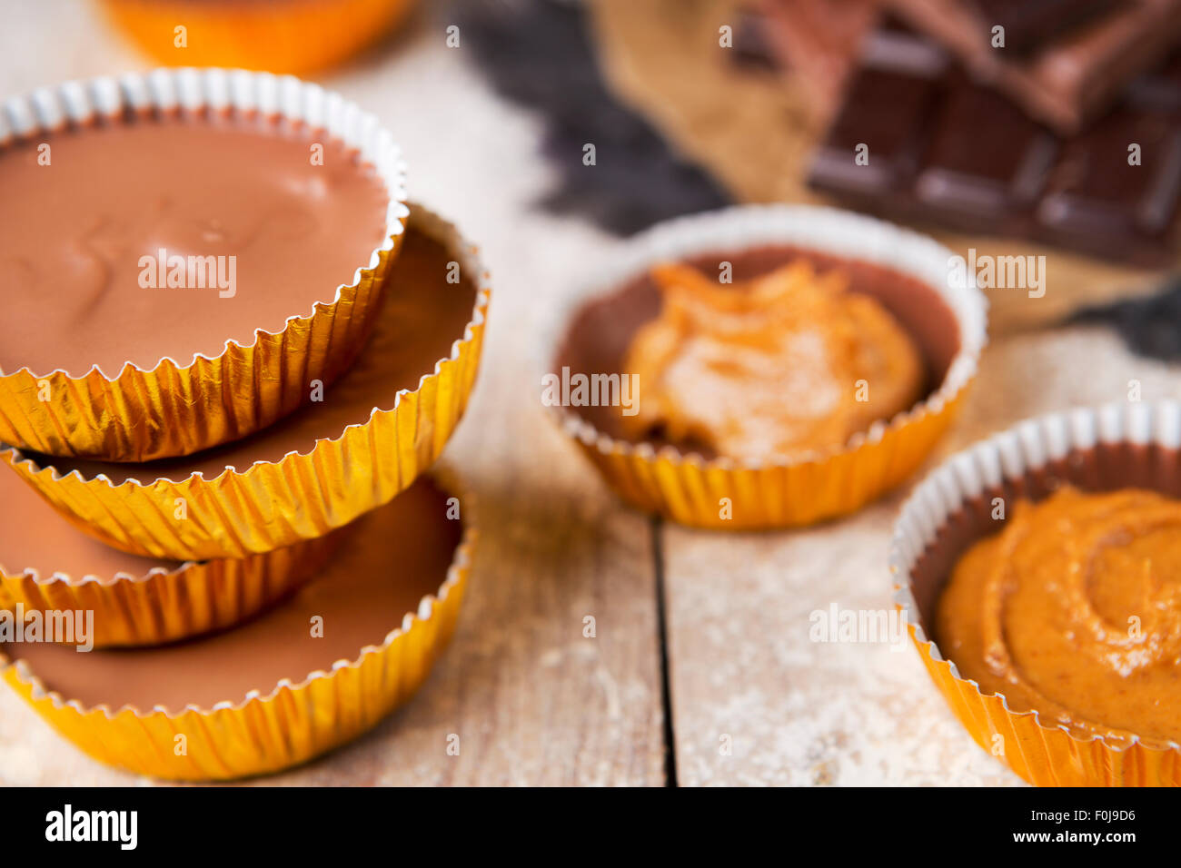 Homemade peanut butter cups on a rustic wooden table. Stock Photo