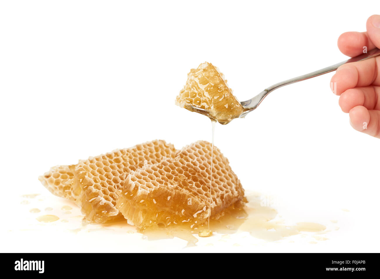 One spoon of honey over heap of raw Stock Photo Alamy