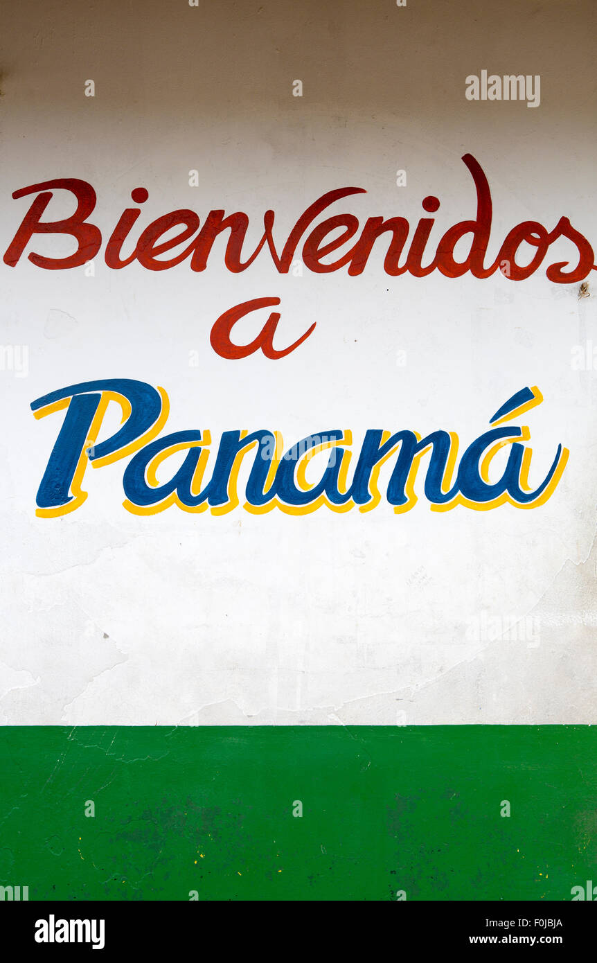 Sign welcome in Panama painted on a white and green wall at Sixaola border with vintage style. 2014 Stock Photo