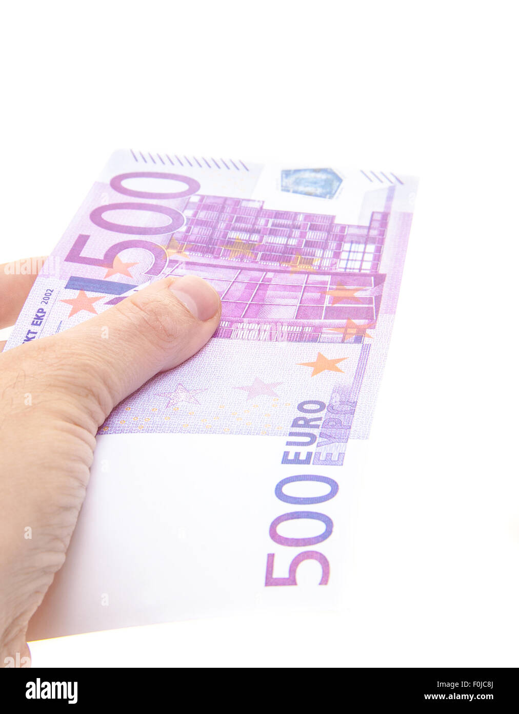 Hand holding 500 euro note Stock Photo
