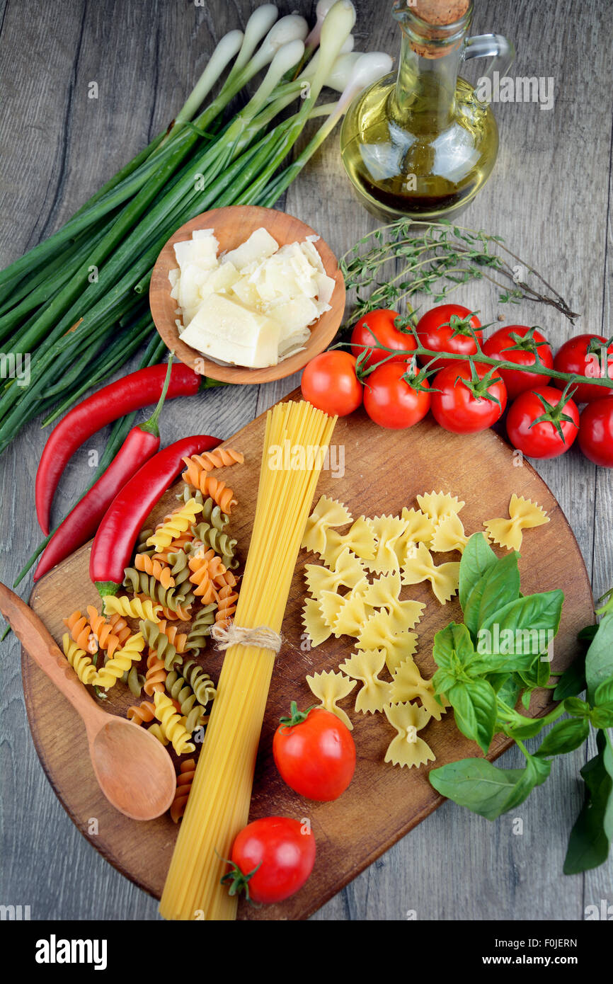 Different kinds of raw pasta on the table Stock Photo