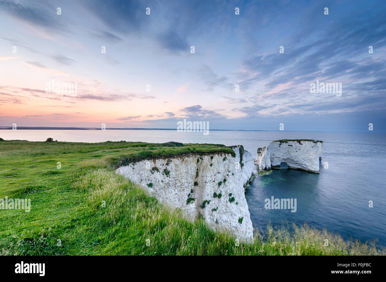 Sunset over Old Harry Rocks near Swanage and the start of the Jurassic Coast in Dorset Stock Photo