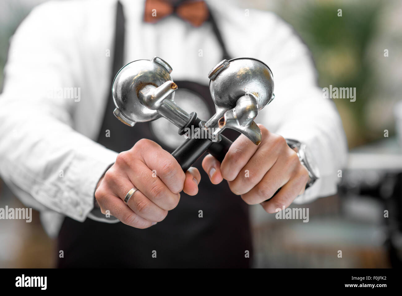 Holding coffee machine holders Stock Photo Alamy