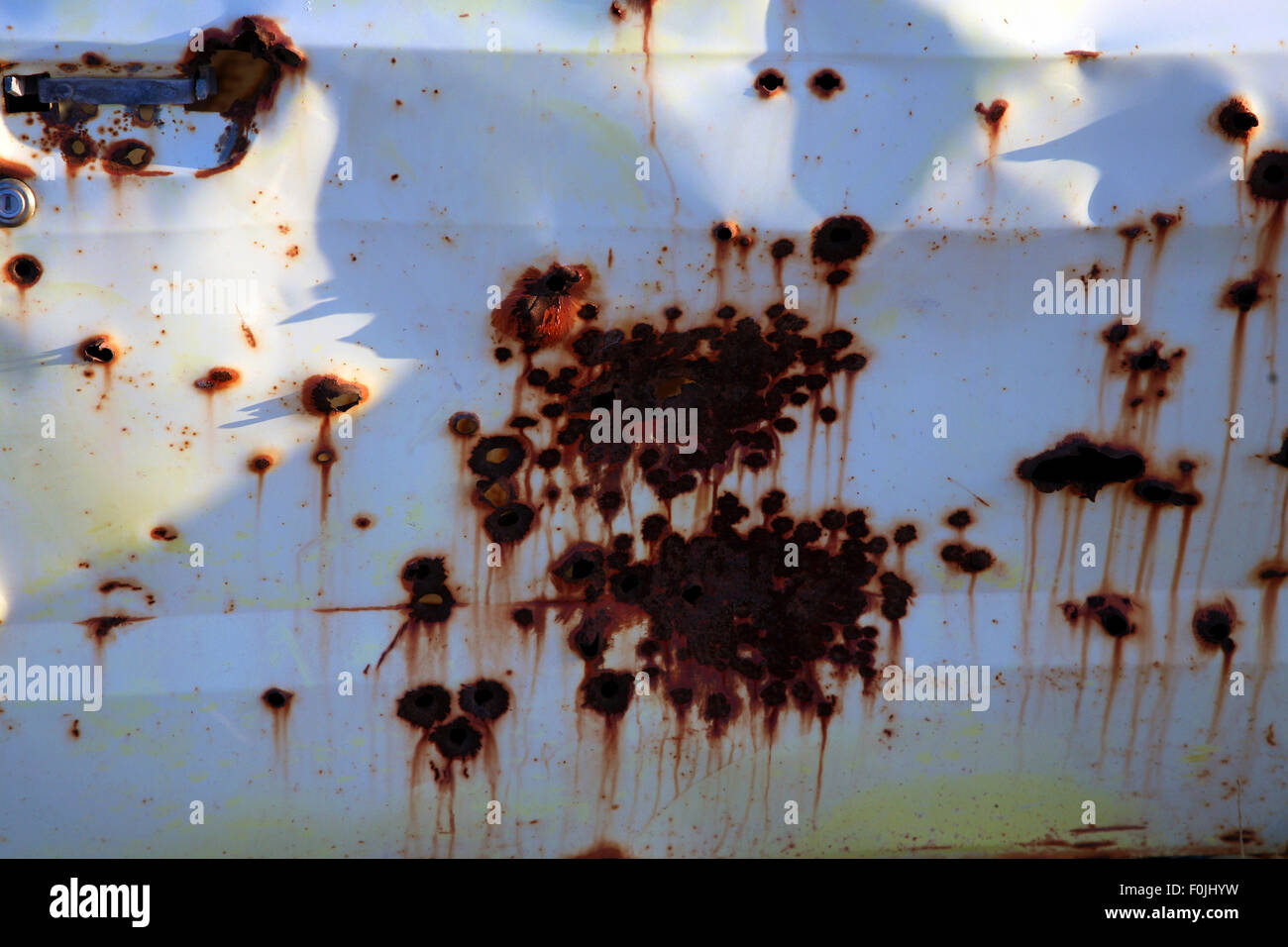 Bullet holes in an old car Stock Photo - Alamy