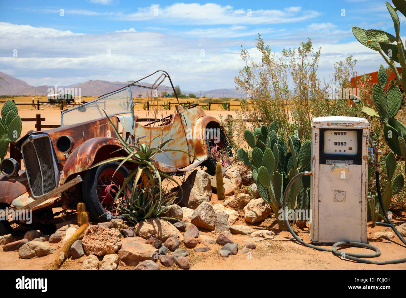 Old and rusty car wreck at the last gaz station before the namibian ...