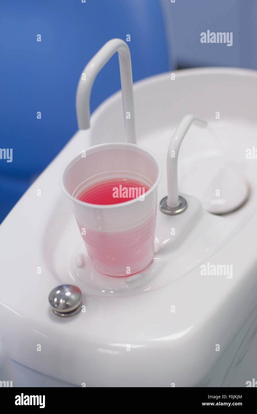 Dental cuspidor and disposable cup, closeup Stock Photo Alamy