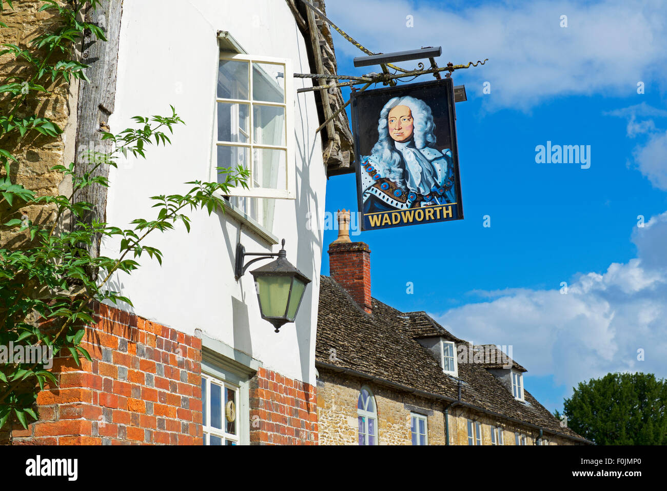 Sign for the George Inn, in the village of Lacock, Wiltshire, England UK Stock Photo