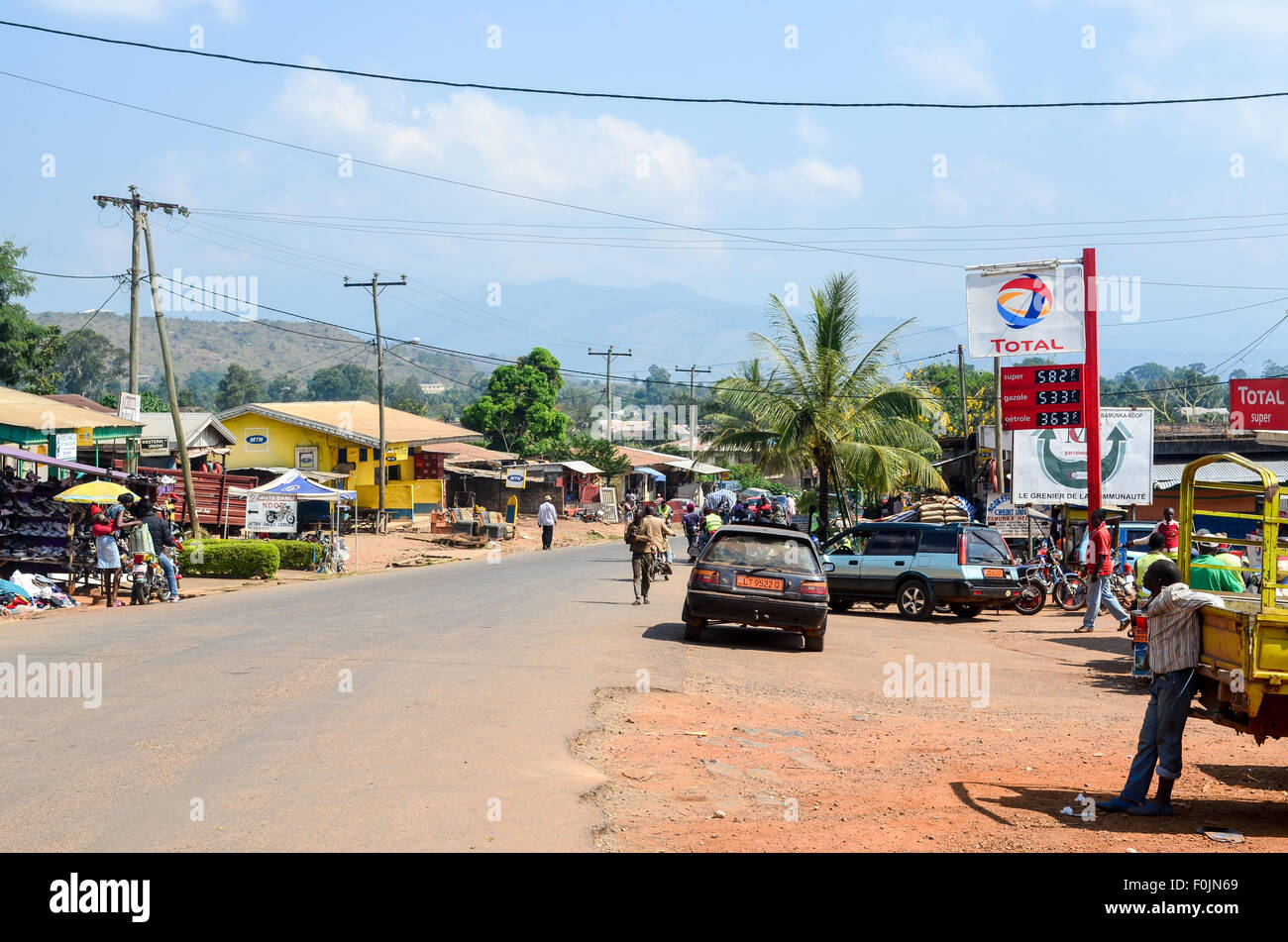 Main street of Ndop a small town in Cameroon with a Total petrol station Stock Photo