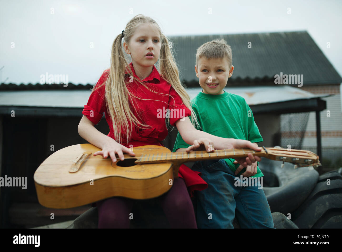 children learn to play the guitar Stock Photo Alamy