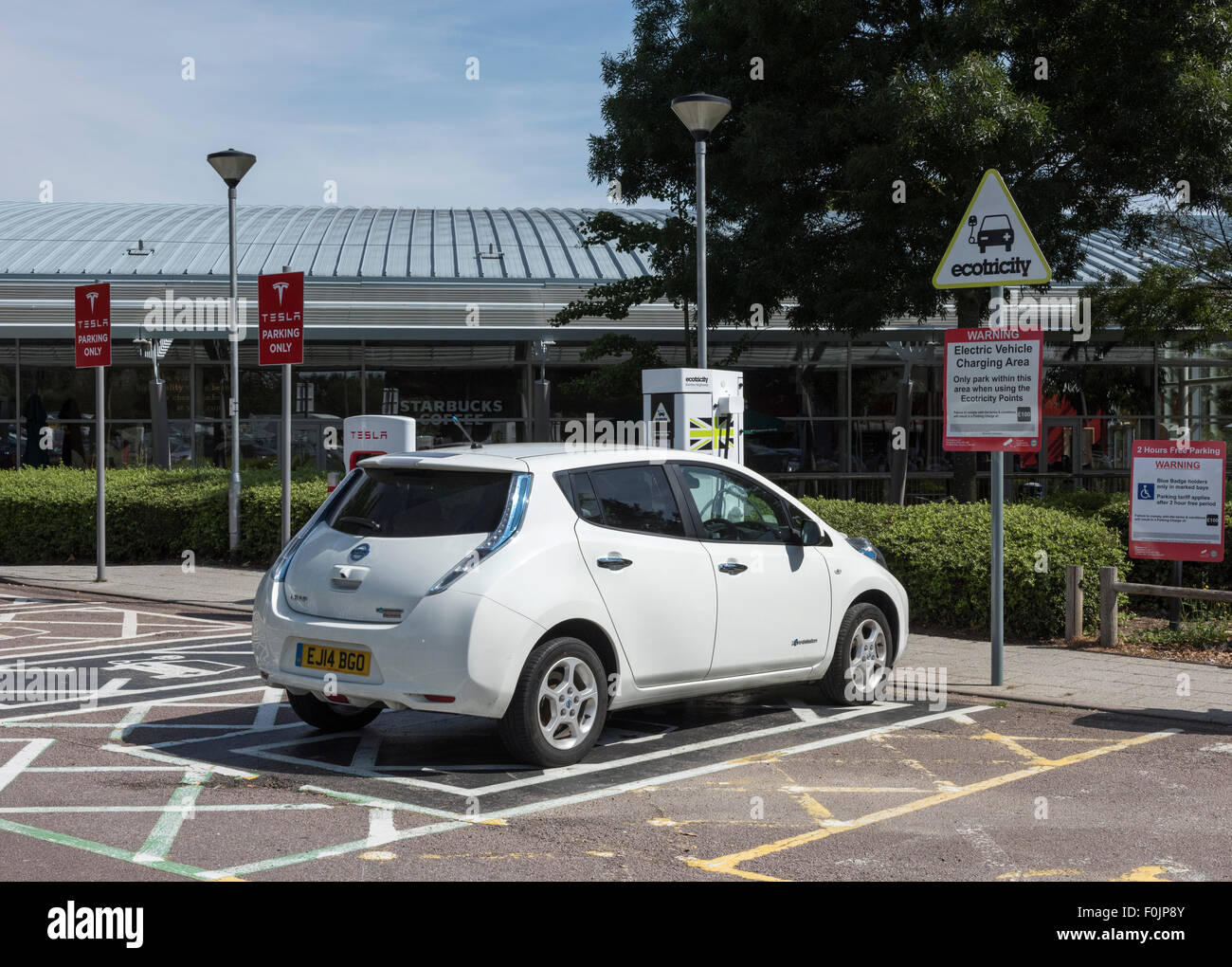 Nissan Leaf at Ecotricity Charging Point at Motorway Services UK Stock Photo
