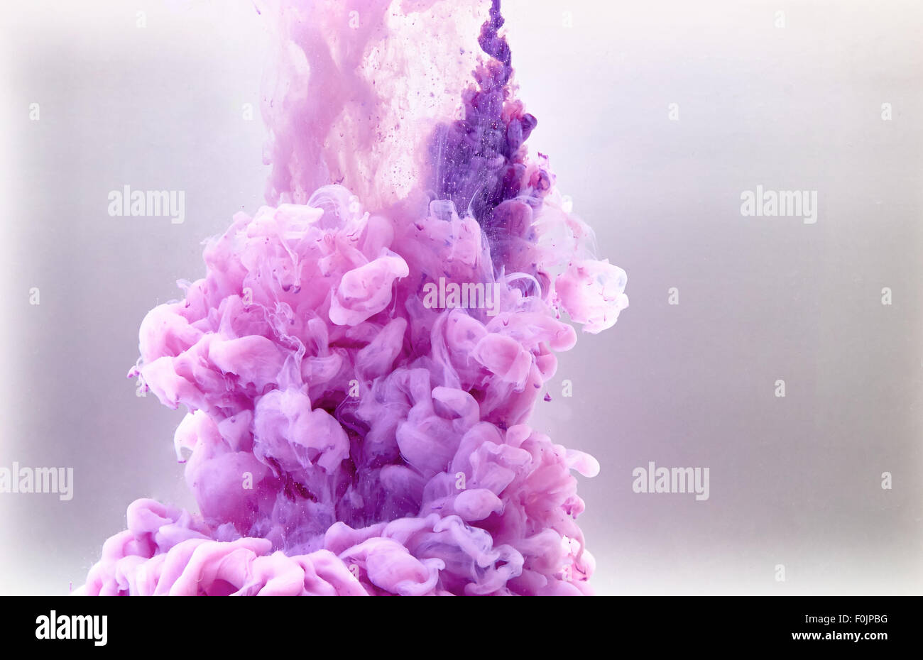 Violet pastel ink smoke cloud in water Stock Photo