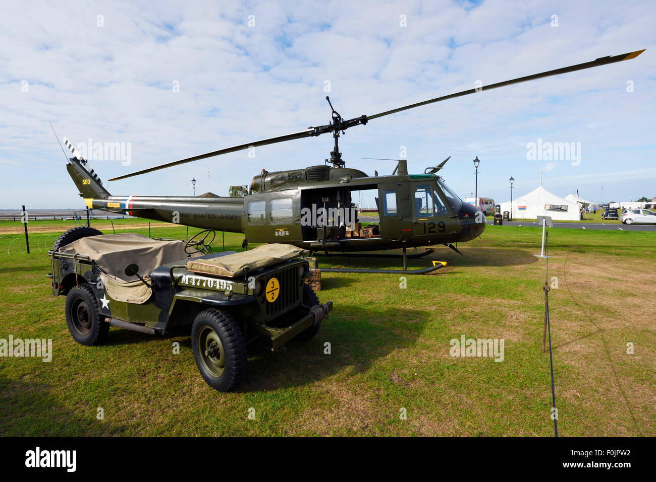 US Army Jeep and Huey 509 Helicopter Stock Photo