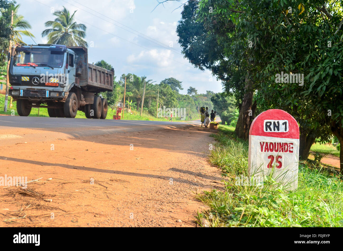 Milestone marking 25 km to Yaoundé, capital city of Cameroon, on the National Road 1 Stock Photo