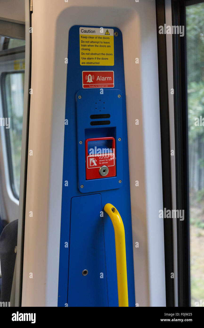 Emergency alarm sign on a London Midland train Stock Photo Alamy