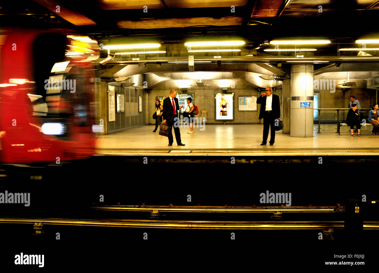 London, England, UK. London Underground tube station platform - train arriving Stock Photo