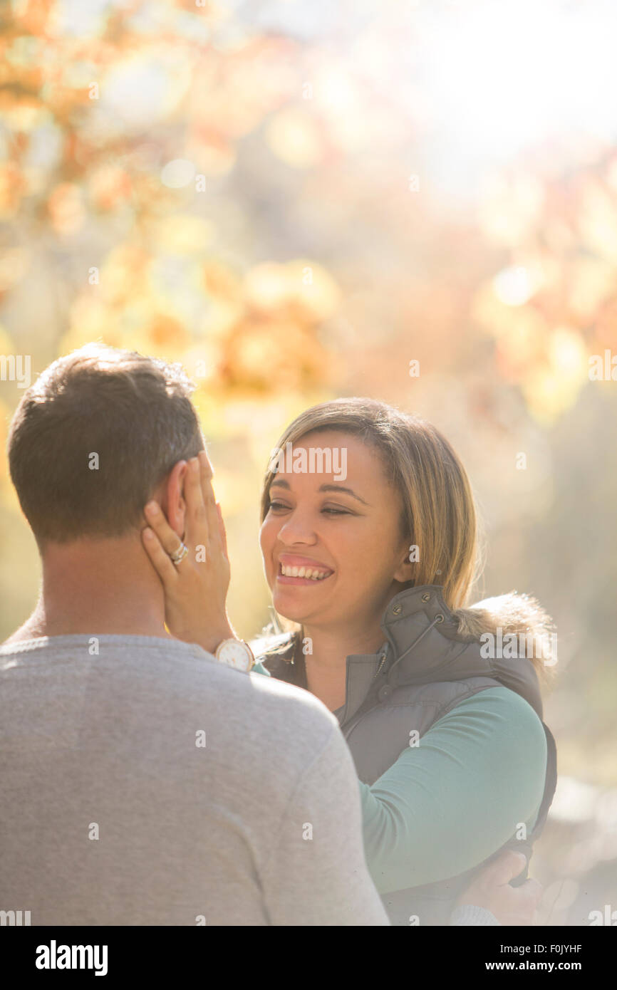 Affectionate couple hugging face to face Stock Photo