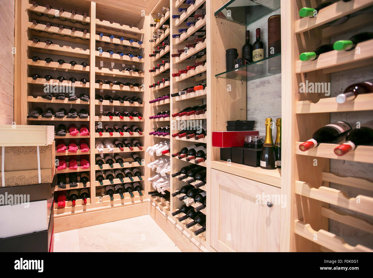Wine bottles organized on racks in wine cellar Stock Photo