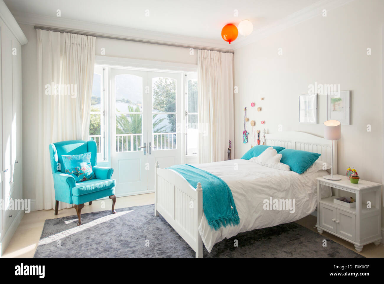 Turquoise color accents in child’s bedroom Stock Photo