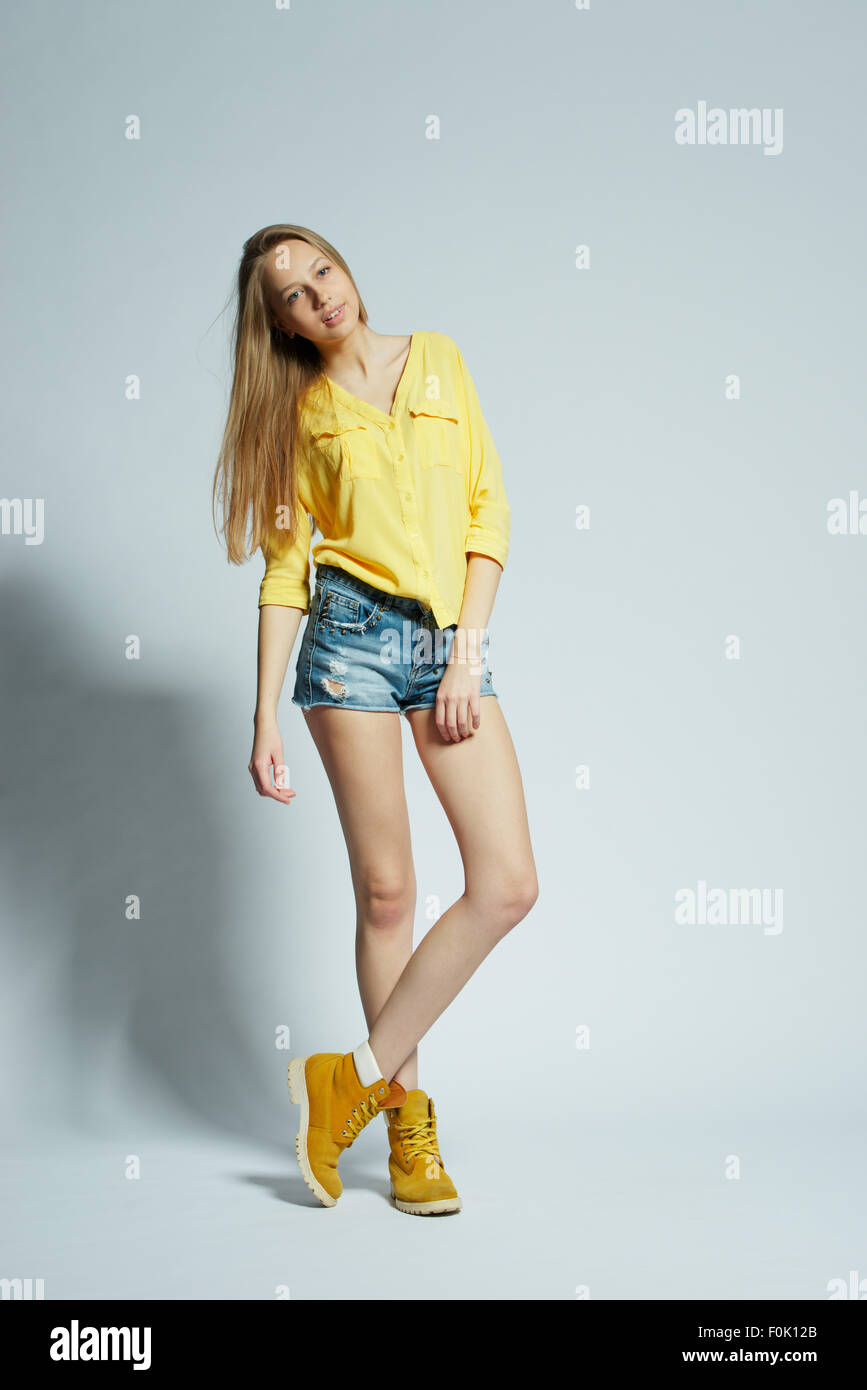 girl with long hair posing in studio Stock Photo - Alamy