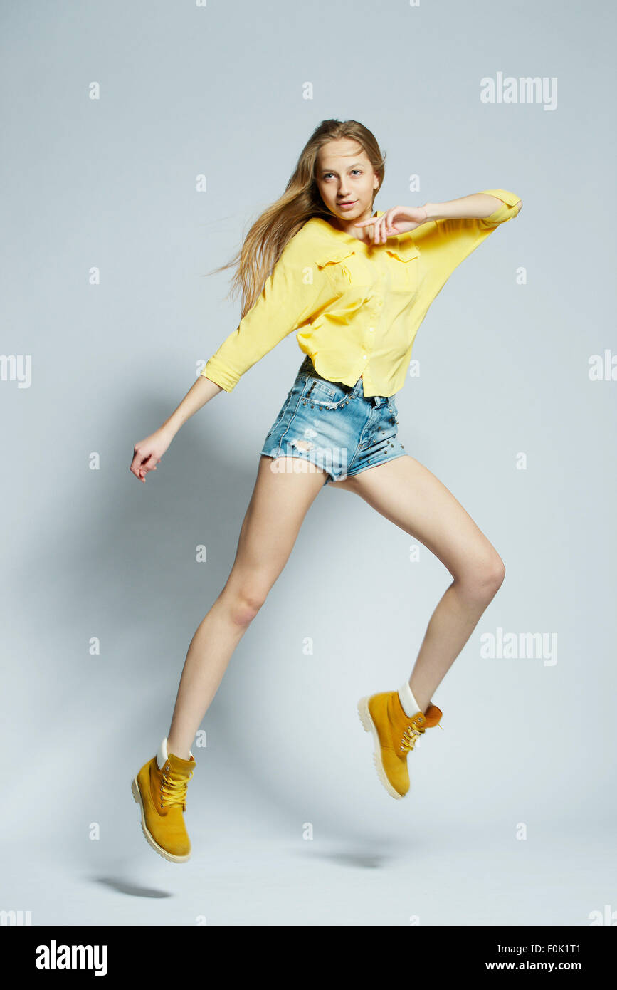girl with long hair posing in studio Stock Photo - Alamy