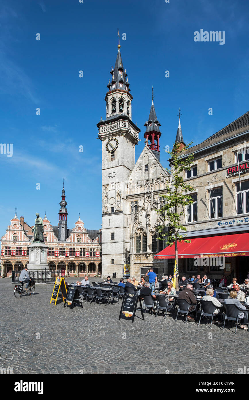 Belfry and tourists at outdoor café on the town square in Aalst / Alost, East Flanders, Belgium Stock Photo