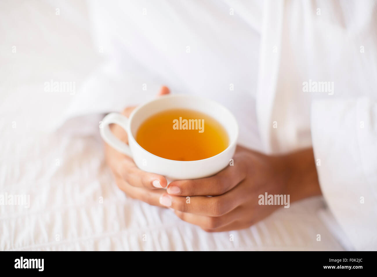 Close up woman holding cup of tea Stock Photo