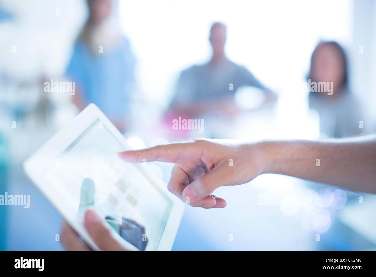 Close up businessman pointing to digital tablet in meeting Stock Photo ...