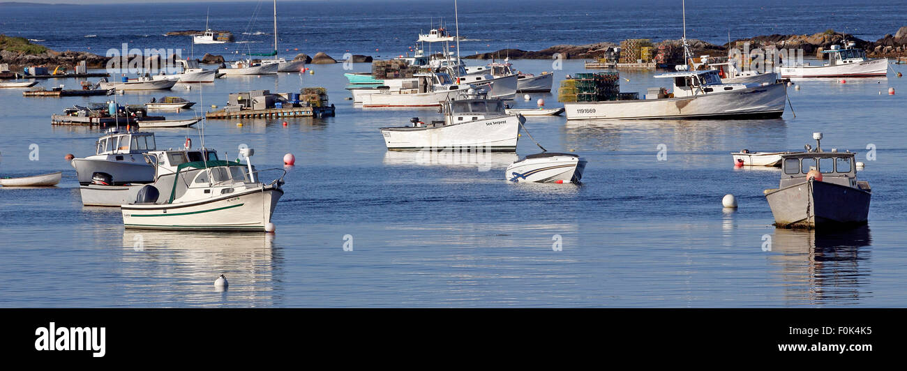 Lobster boats on moorings in harbor Vinalhaven Island Maine New England USA Stock Photo