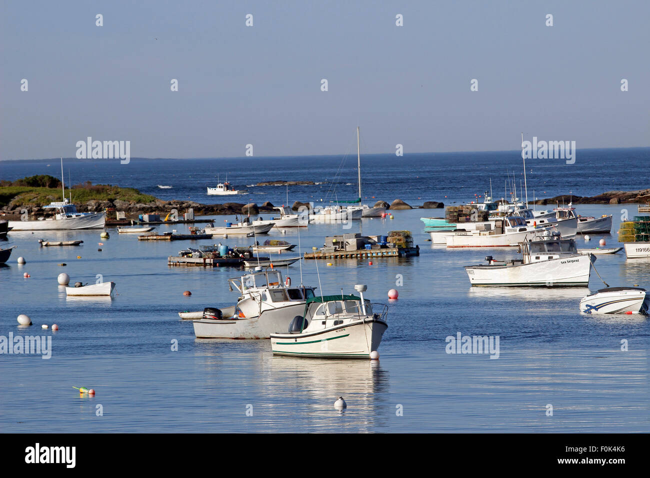 Lobster boats on moorings in harbor Vinalhaven Island Maine New England USA Stock Photo