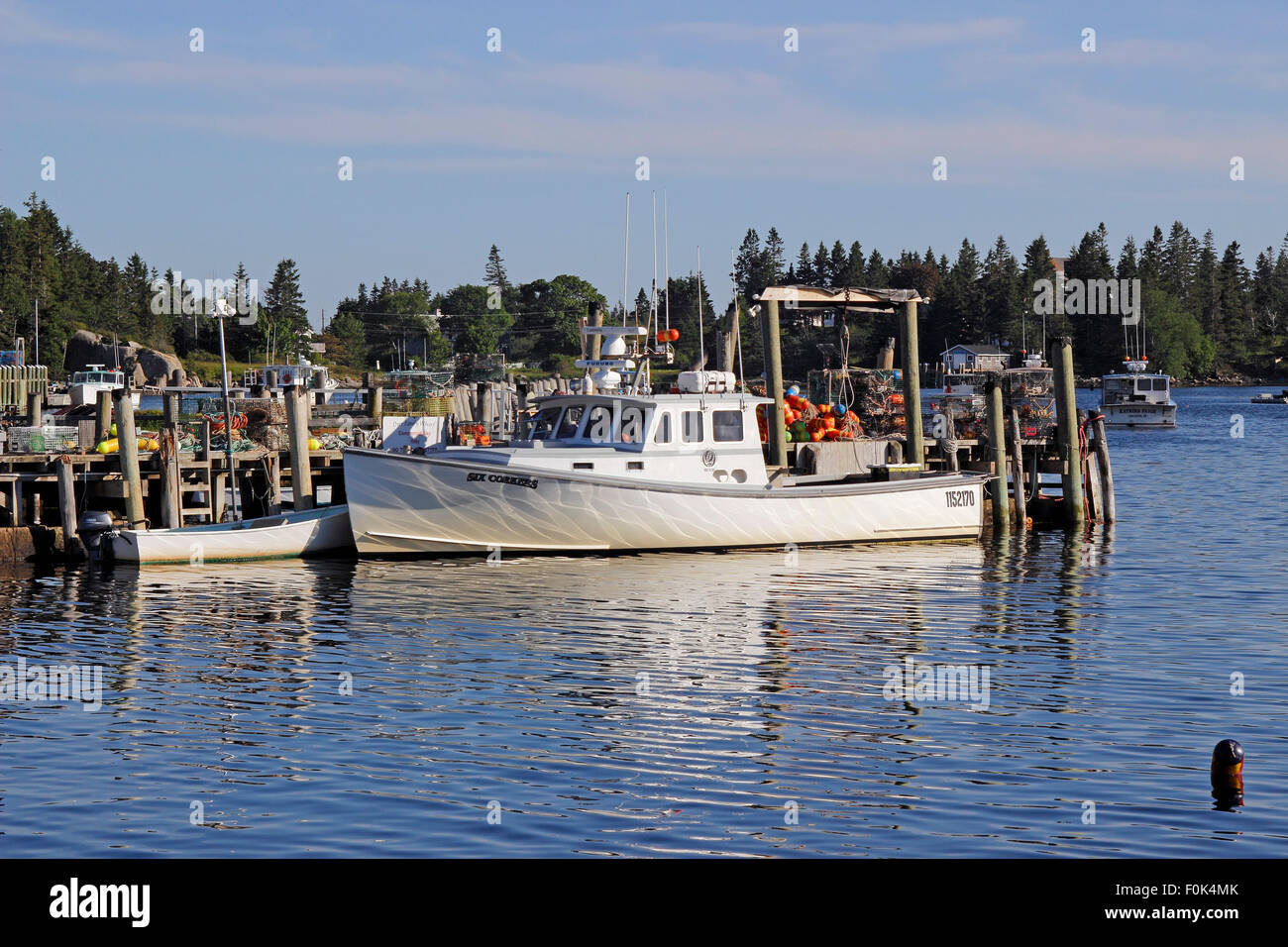 Lobster boat at dock waterfront Vinalhaven Island Maine New England USA ...