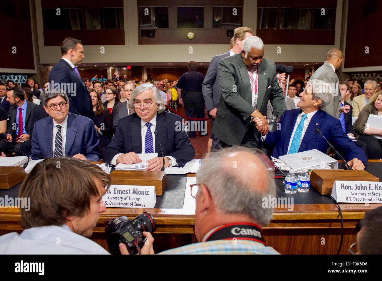 Senate Staffer Greets Secretary Kerry Before Testifying About Iranian Nuclear Deal in Congress Senate Staffer Greets Secretary Kerry Before Testifying About Iranian Nuclear Stock Photo