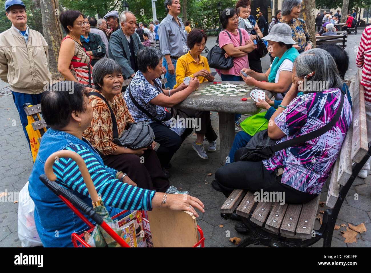 New York City, USA, Group Chinese Immigrants Asian, Senior Women, Playing Traditional Chinese Board Games in Chinatown District, in Public Park, senior people activities, retirement pensioners fun, older women group serious, social security senior Stock Photo