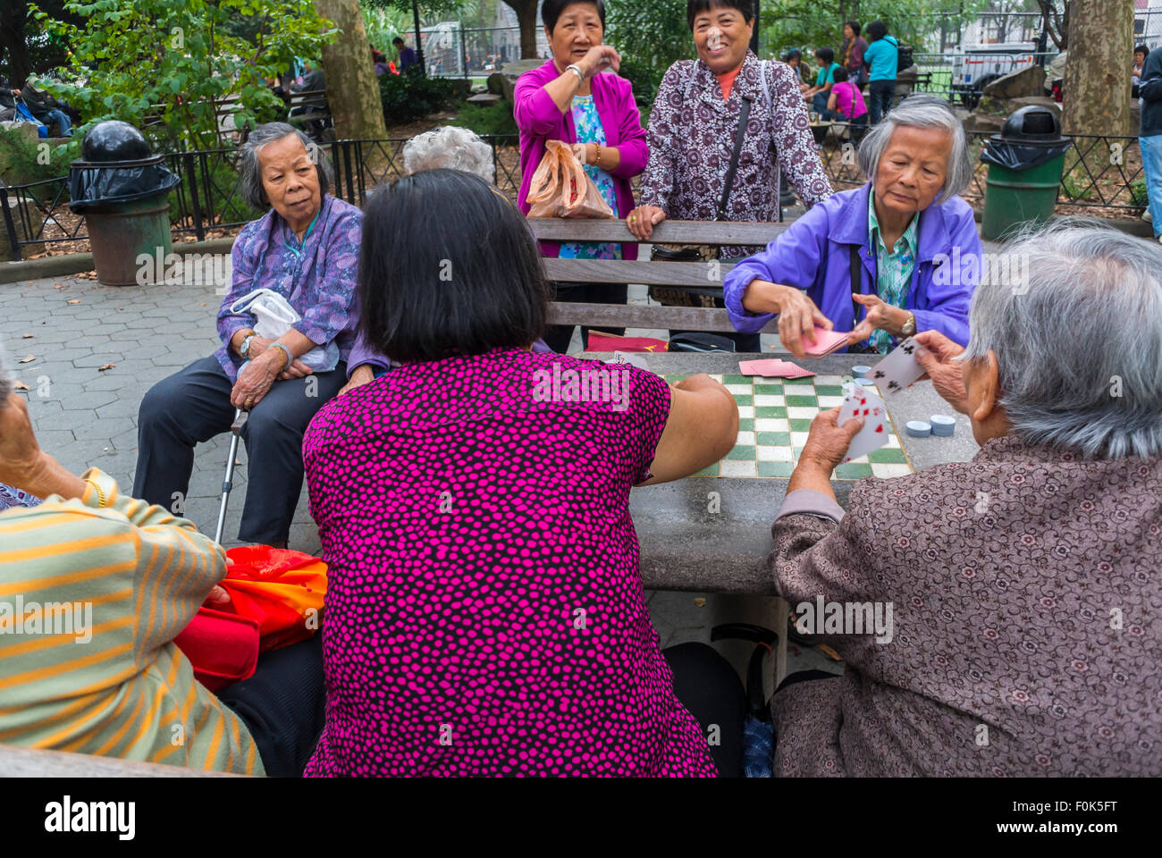 New York City, USA, Group Chinese Immigrants Asian, Senior Women, Playing Traditional Chinese Board Games in Chinatown District, in Public Park, retirement pensioners fun, older women group serious,  low income urban usa migrants Stock Photo