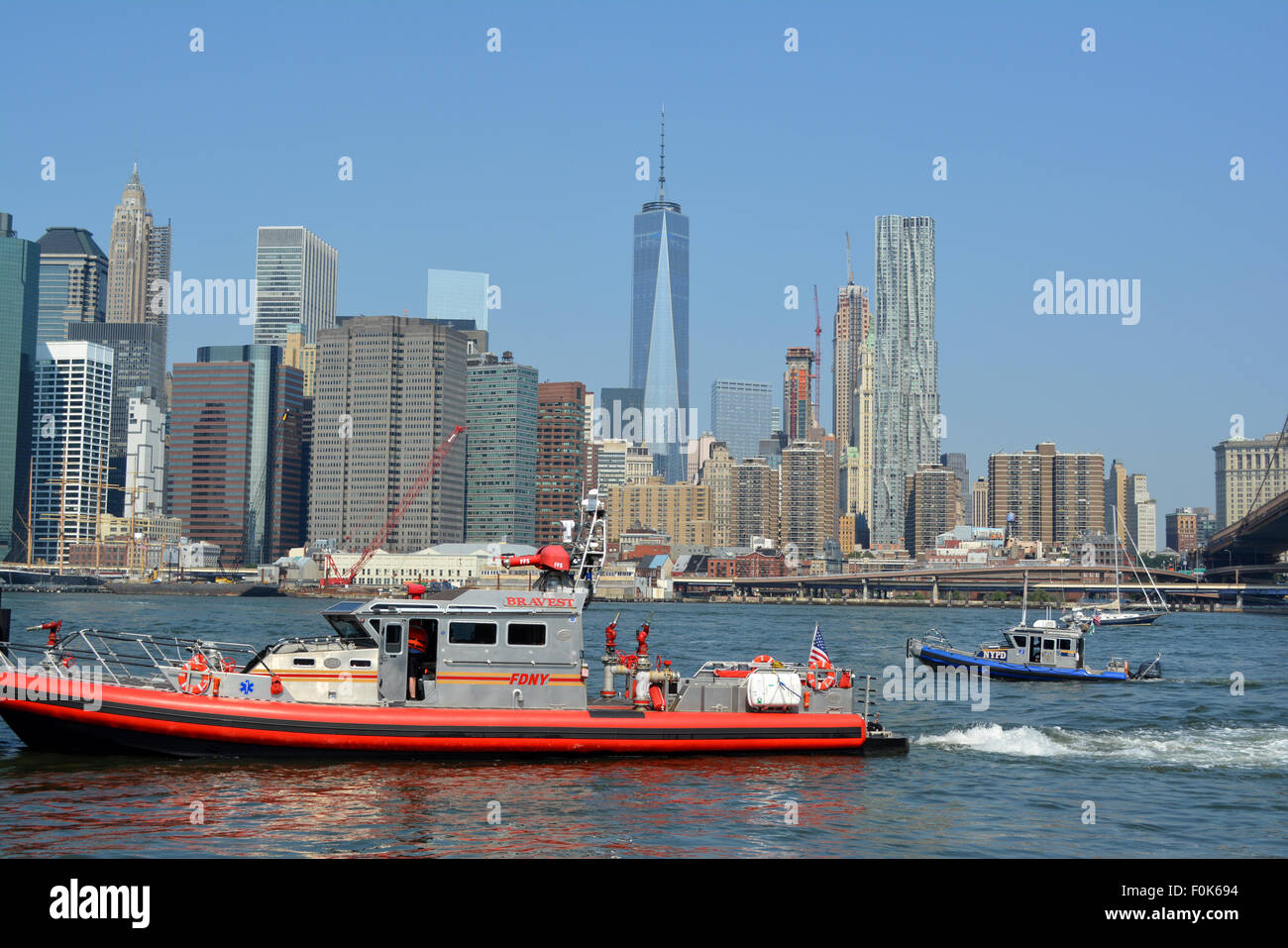 FDNY and NYPD boats responding to an emergency on the East River in New York City. Stock Photo