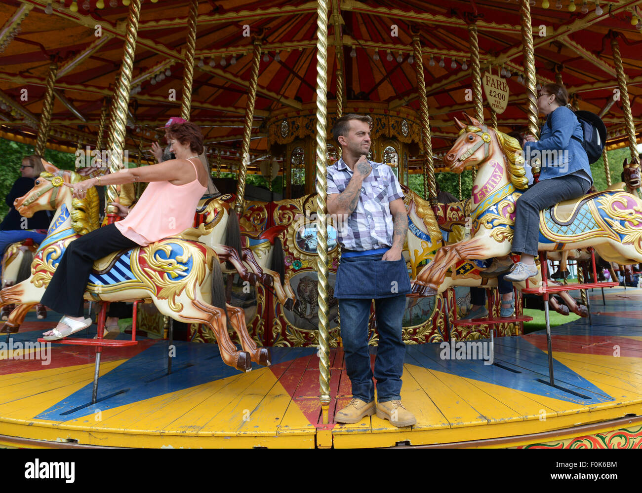Traditional British merry go round fairground carousel ride Stock Photo