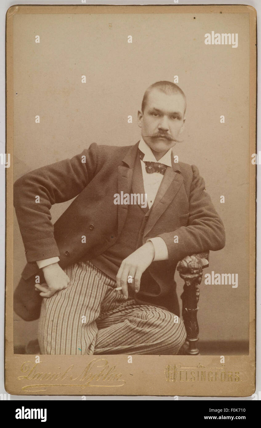 Photography studio portrait of Axel Gallén with a cigarette, Helsinki, 1890. Photography studio portrait of Axel Gallén with a cigarette, Helsinki, Stock Photo